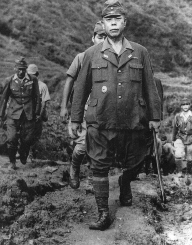 General Yamashita Surrenders: General Yamashita, Commander, Japanese forces, ‘Tiger of Malaya,” and his staff walk down the trail to U.S. forces in northern Luzon, occupied by Co ‘
