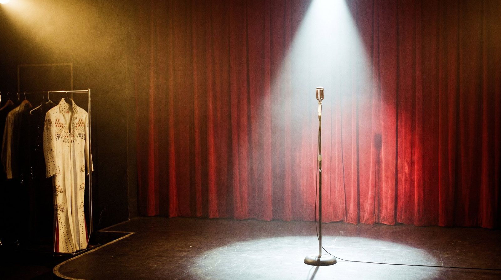 AI illustration: An empty 1970s Las Vegas showroom stage before the show, a microphone in the spotlight
