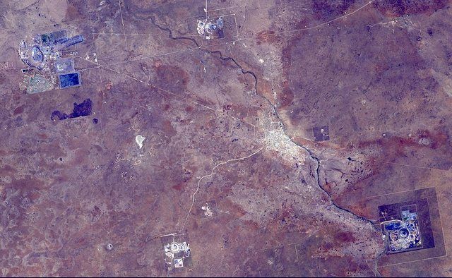 Orapa Diamond Mine, Botswana (ASTER): The Orapa diamond mine is the world's largest diamond mine by area. The mine is located in Botswana. It is the oldest of four mines operated b