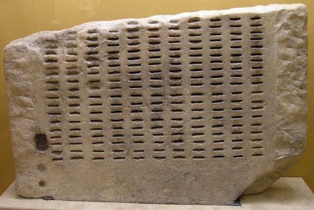 AGMA Kleroterion: Kleroterion. This device was used for the jury selection system in Athens. Bronze identification tickets were inserted to indicate eligible jurors who were also d