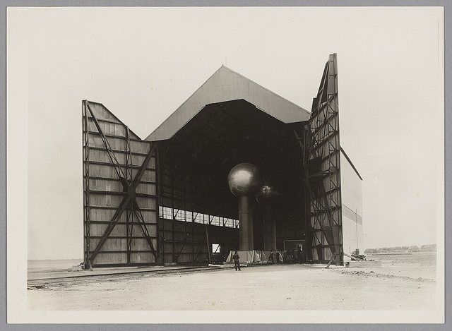 Round Hill generator in hangar 1933 original: The Round Hill Van de Graaff generator, designed to produce 10 MV, inside the dirigible hanger at the Round Hill Research Station, Sou