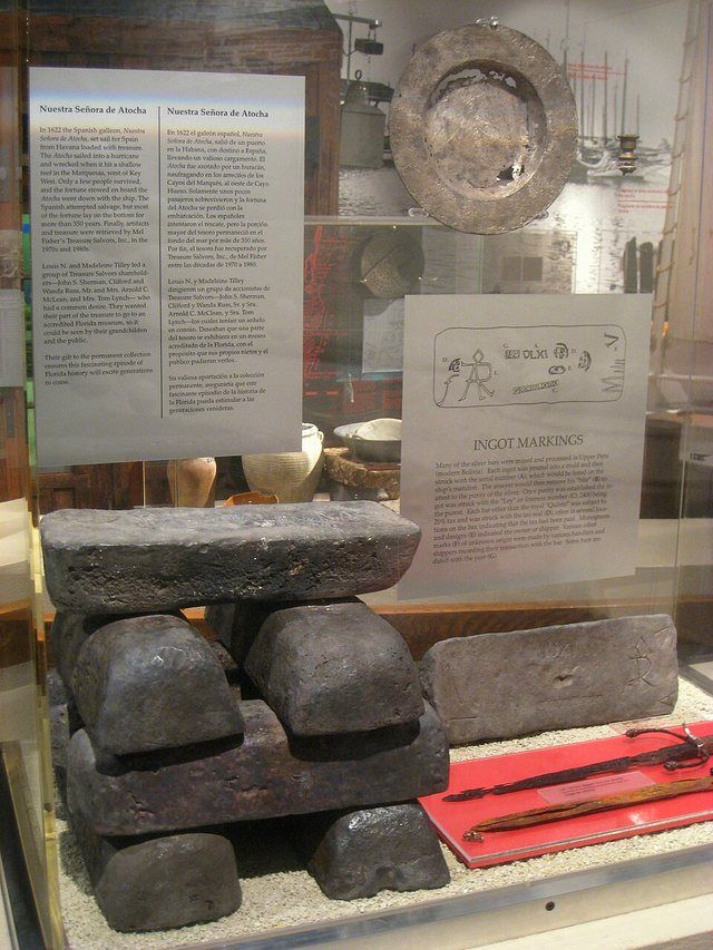 Silver ingots - HistoryMiami - IMG 8113: Silver ingots salvaged from the wreck of the Nuestra Senora de Atocha, sunk by storm in the Marquesas in 1622; silver primarily from (prese