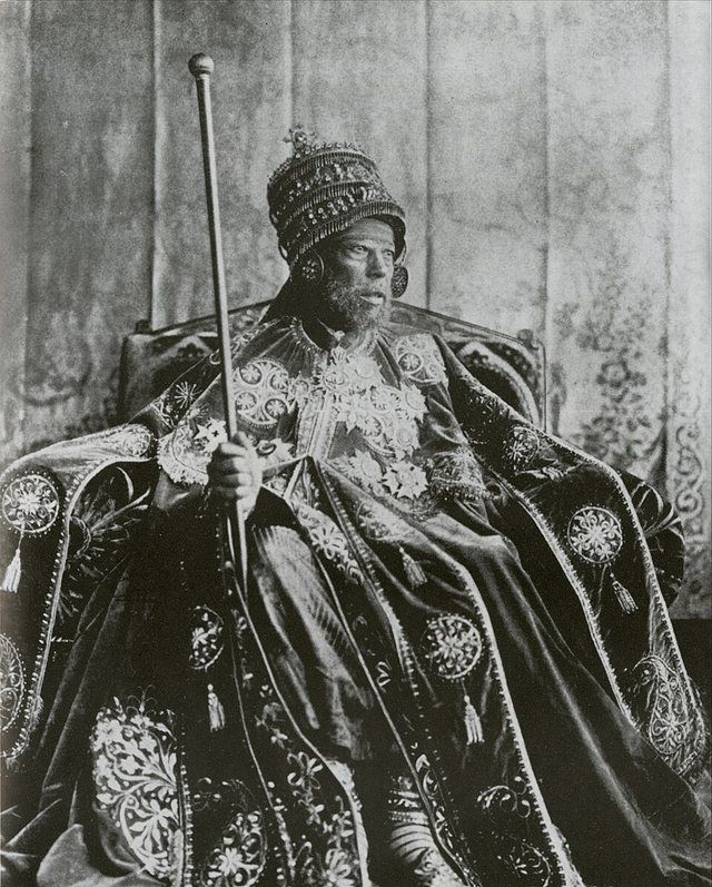 Menelik II: Emperor Menelik II photographed on the throne in coronation garb.