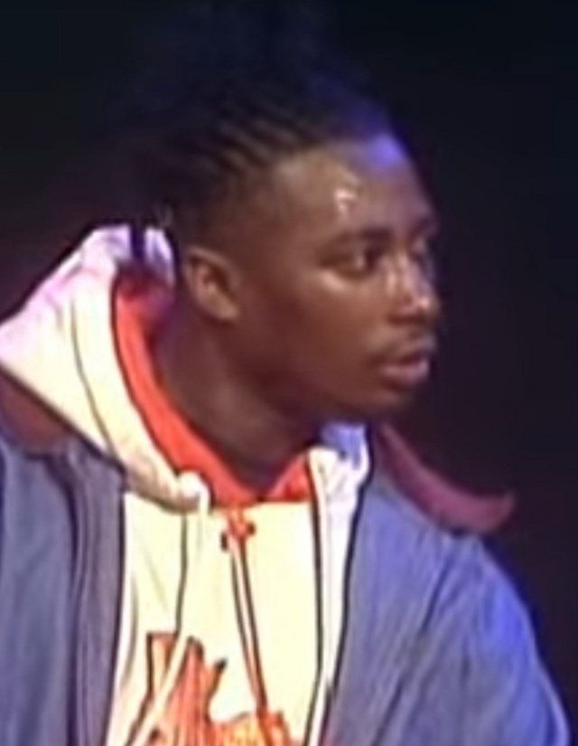 Ol' Dirty Bastard: Ol' Dirty Bastard, an American rapper, performing on MTV. He is wearing a blue jacket, and against a black background