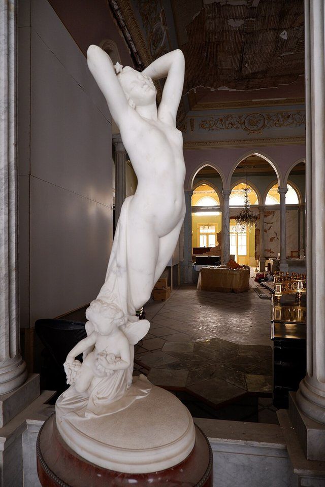 Sursock Palace main hall after explosion: Second hall of the Sursock Palace, emptied of most furnishings after the 2020 Beirut port explosion. Statue depicts the Allegory of the Ni