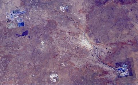 Orapa Diamond Mine, Botswana (ASTER): The Orapa diamond mine is the world's largest diamond mine by area. The mine is located in Botswana. It is the oldest of four mines operated b