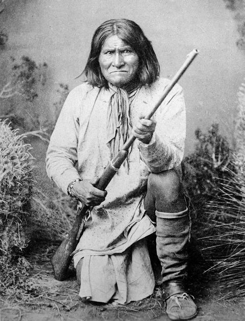 Geronimo: Geronimo (Goyathlay), a Chiricahua Apache; full-length, kneeling with rifle