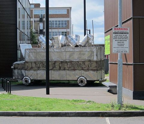 Bus Memorial to Ken Saro-Wiwa (5927206987): 9 July 2011. Ten feet high, steel sculpture of a Nigerian Bus parked behind the Bernie Grant Arts Centre, Tottenham. It's a memorial to