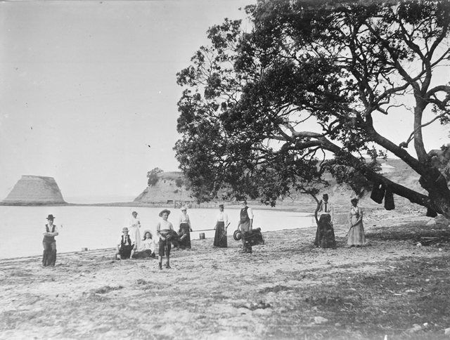Takaparawhau & Bastion Rock 1901: Looking east along Biddicks Bay towards Takaparawhau showing Bastion Rock, since demolished, 1901.