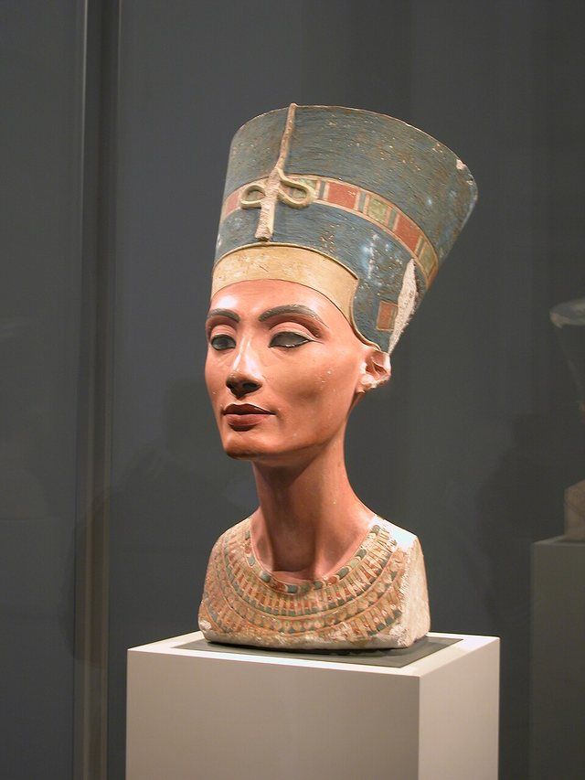 Nefertiti Bust Neues Museum Berlin: The iconic painted limestone bust of Queen Nefertiti, the Great Royal Wife of the Egyptian Pharaoh Akhenaten. Crafted by the sculptor Thutmose c