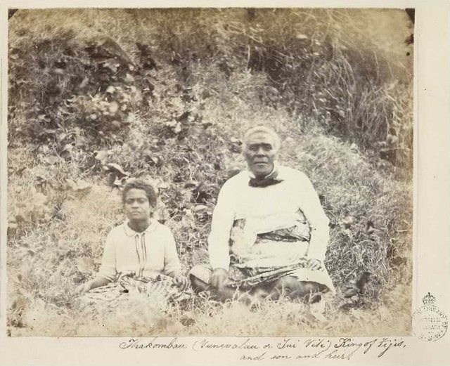 Cakobau with son and heir, 1861: Seated portrait of Thakombau, king of the Fijian group and his son (possibly Ratu Epeli Nailatikau). When the British HMS Pelorus was in Fiji in 18